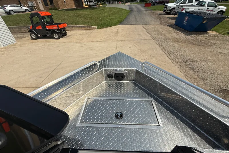 Slide: The Image of Bow view of 2026 Lund 210 Heavy Gauge boat with diamond plate flooring. - 24