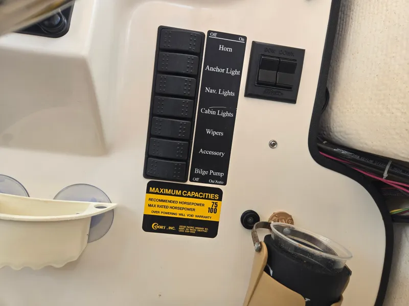 Slide: The Image of Close-up of a boat control panel with switches for horn, anchor light, nav lights, and more. - 18