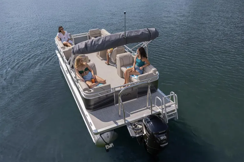 Slide: The Image of Manufacturer Provided Image: 2025 Avalon VENTURE QUAD LOUNGER pontoon boat on water with passengers relaxing. - 7