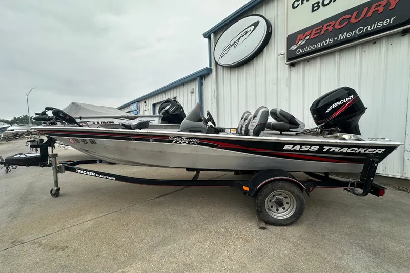 The Image of 2006 Bass Tracker Pro 17 boat with Mercury outboard motor on trailer. - 0