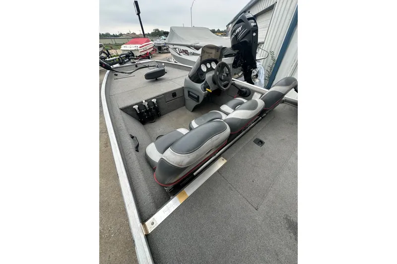 Slide: The Image of 2006 Bass Tracker Pro 17 boat interior with seating and steering console. - 19