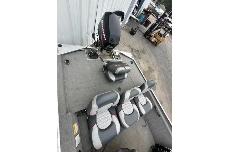 Slide: The Image of 2006 Bass Tracker Pro 17 boat interior with Mercury engine and seating arrangement. - 16