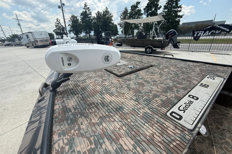 Slide: The Image of 2024 Pro-Drive 1854 SBX TD boat with camo deck and Minn Kota Terrova motor. - 6