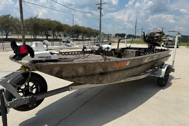 Slide: The Image of 2024 Pro-Drive 1854 SBX TD boat on trailer, featuring Minn Kota Terrova motor. - 3