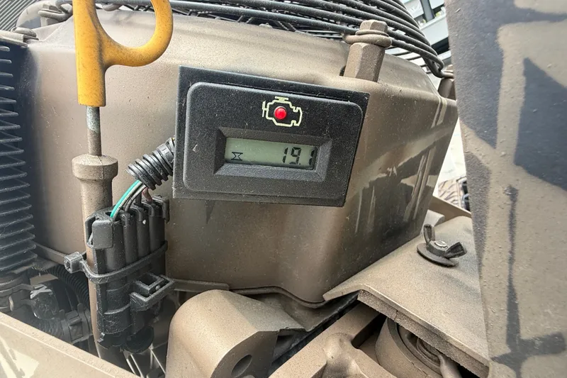 Slide: The Image of Close-up of a 2024 Pro-Drive 1854 SBX TD engine display showing 19 hours. - 10