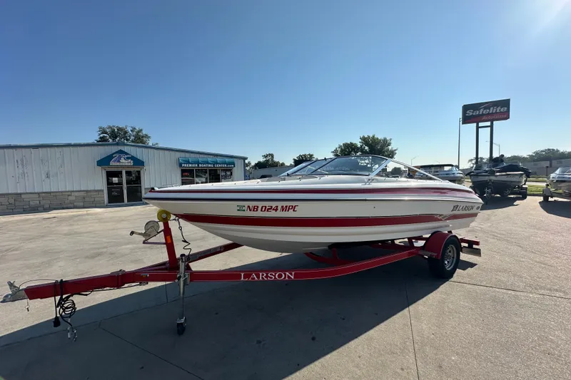 Slide: The Image of 2004 Larson SEi 190 boat on trailer at Premier Boating Center. - 2