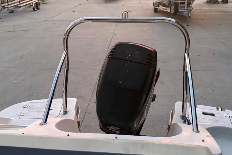 Slide: The Image of 2005 Starcraft SD 201 boat with outboard motor and stainless steel railing. - 17