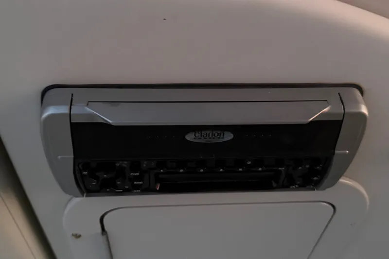 Slide: The Image of Ceiling-mounted Clarion audio system in a 2005 Starcraft SD 201 vehicle interior. - 18