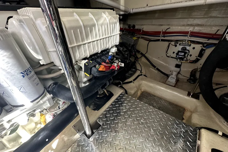 Slide: The Image of Engine room of a 2014 Marquis 420 Sport Bridge, featuring Volvo Penta components. - 47