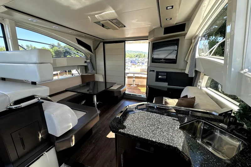 Slide: The Image of Luxurious interior of 2014 Marquis 420 Sport Bridge yacht with modern amenities and sleek design. - 27