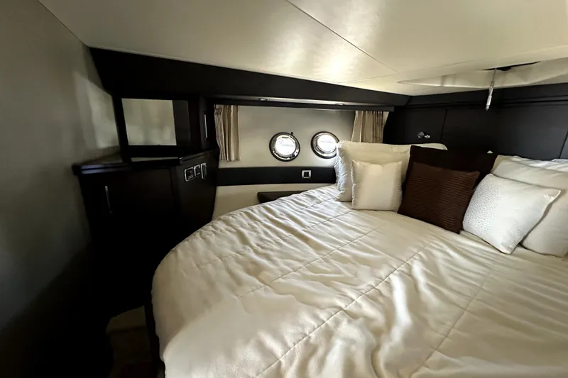 Slide: The Image of Luxurious bedroom interior of 2014 Marquis 420 Sport Bridge yacht with plush bedding. - 43