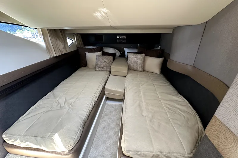 Slide: The Image of Interior cabin of 2014 Marquis 420 Sport Bridge yacht with twin beds and cushions. - 40