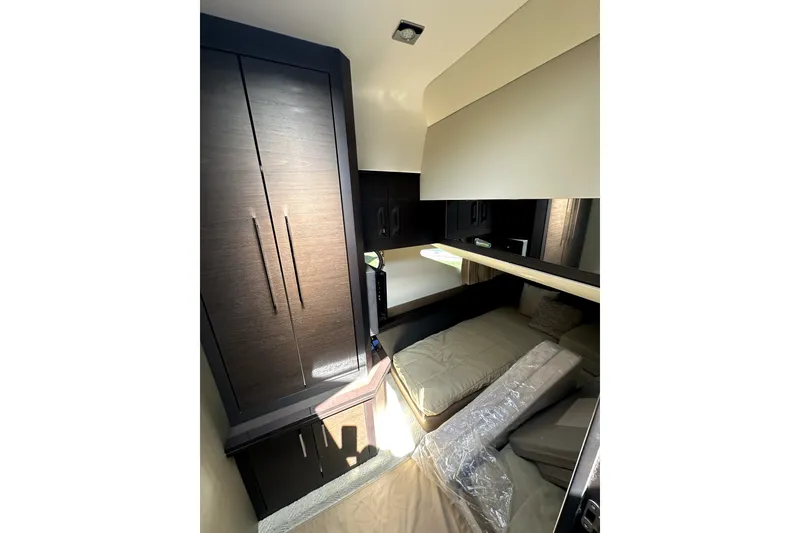 Slide: The Image of Interior cabin of 2014 Marquis 420 Sport Bridge yacht with modern furnishings. - 38