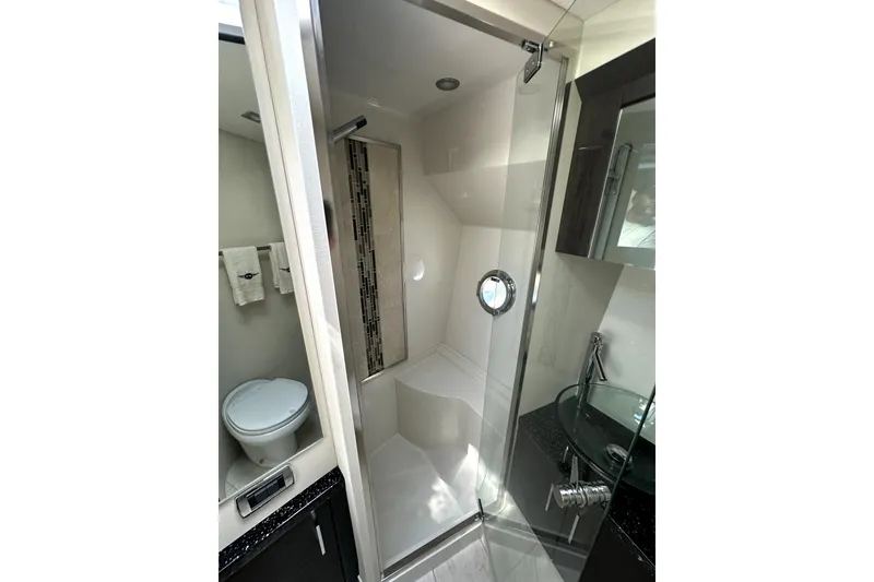 Slide: The Image of Luxurious bathroom in 2014 Marquis 420 Sport Bridge yacht with modern shower and fixtures. - 36