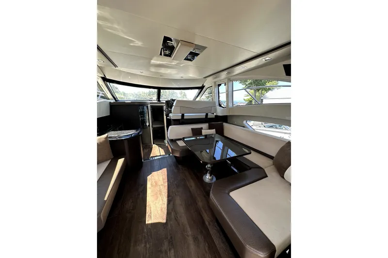Slide: The Image of Luxurious interior of 2014 Marquis 420 Sport Bridge yacht with modern seating and sleek design. - 23