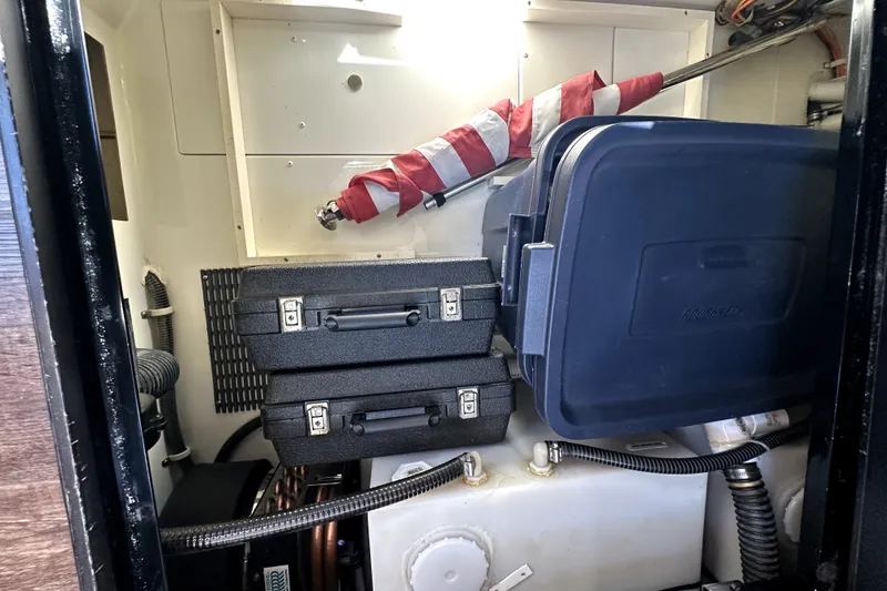 Slide: The Image of Engine room of 2014 Marquis 420 Sport Bridge with storage cases and equipment. - 42