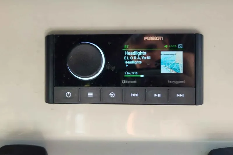 Slide: The Image of Fusion audio system display in a 2022 Regal LS2 boat, playing "Headlights" via Bluetooth. - 17