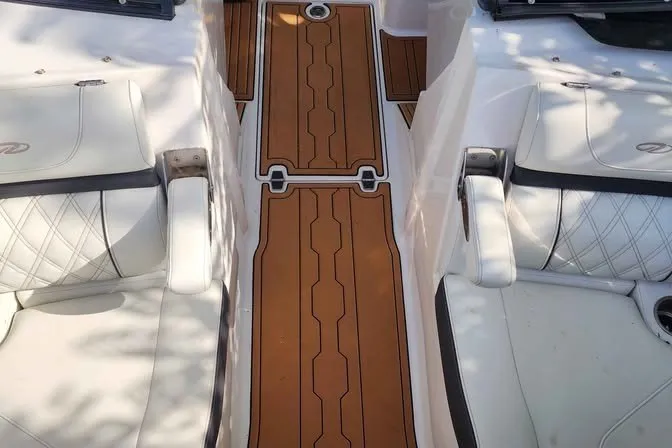 Slide: The Image of Luxurious interior of 2022 Regal LS2 boat with white seating and elegant wood flooring. - 14