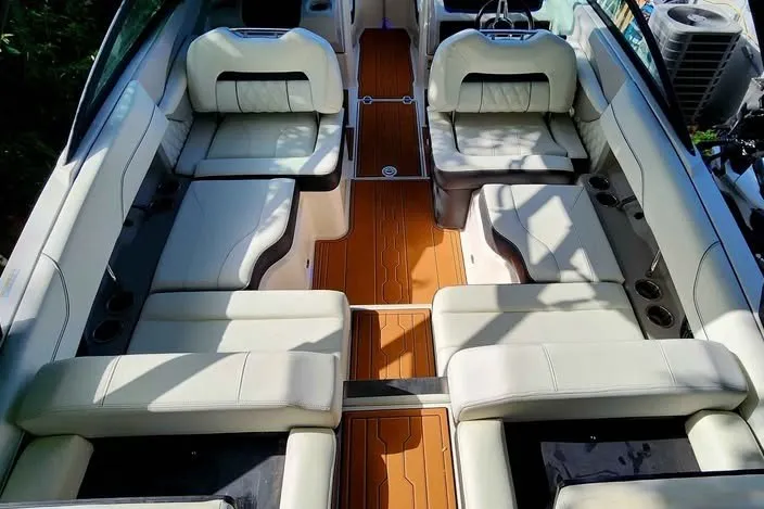 Slide: The Image of Luxurious interior of 2022 Regal LS2 boat with white seating and wooden flooring. - 7