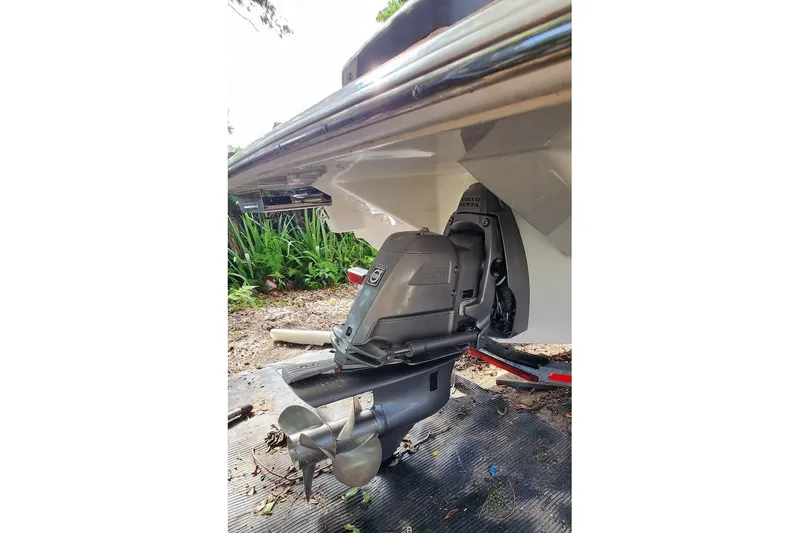 Slide: The Image of 2022 Regal LS2 boat with Volvo Penta outdrive, parked on a trailer. - 19