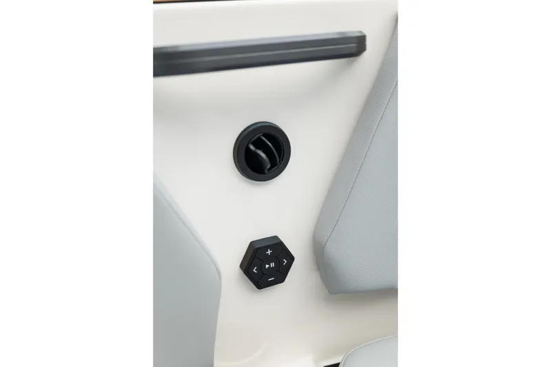 Slide: The Image of 2027 MasterCraft NXT20 interior control panel with audio buttons and air vent. - 44