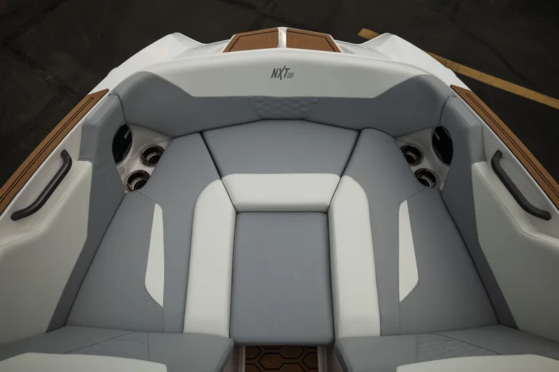 Slide: The Image of 2027 MasterCraft NXT20 boat interior with sleek gray and white seating design. - 38