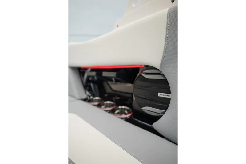 Slide: The Image of Interior of 2027 MasterCraft NXT20 boat featuring Meridian speaker and cup holders. - 31
