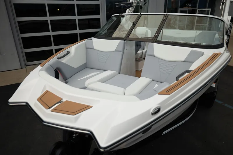 Slide: The Image of 2027 MasterCraft NXT20 boat with sleek white and gray interior design. - 16