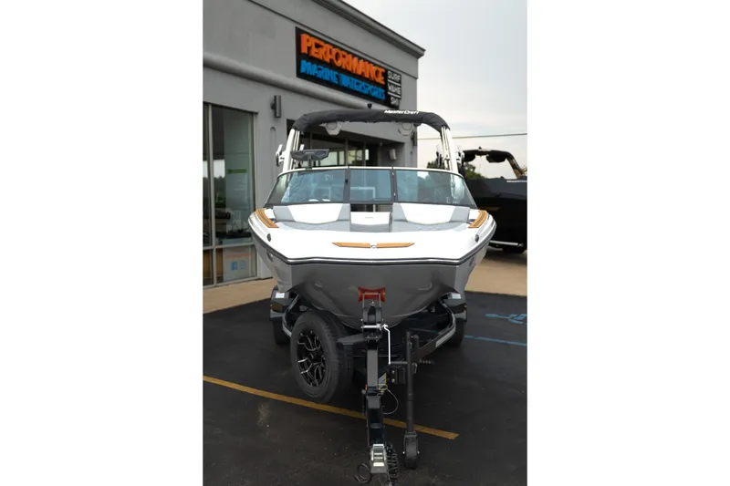 Slide: The Image of 2027 MasterCraft NXT20 boat on trailer outside dealership. - 14