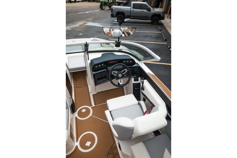 Slide: The Image of Interior view of 2027 MasterCraft NXT20 boat with modern dashboard and seating. - 33