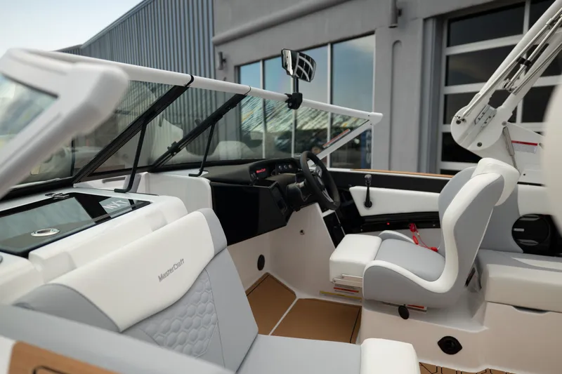 Slide: The Image of 2027 MasterCraft NXT20 boat interior with modern dashboard and seating. - 19