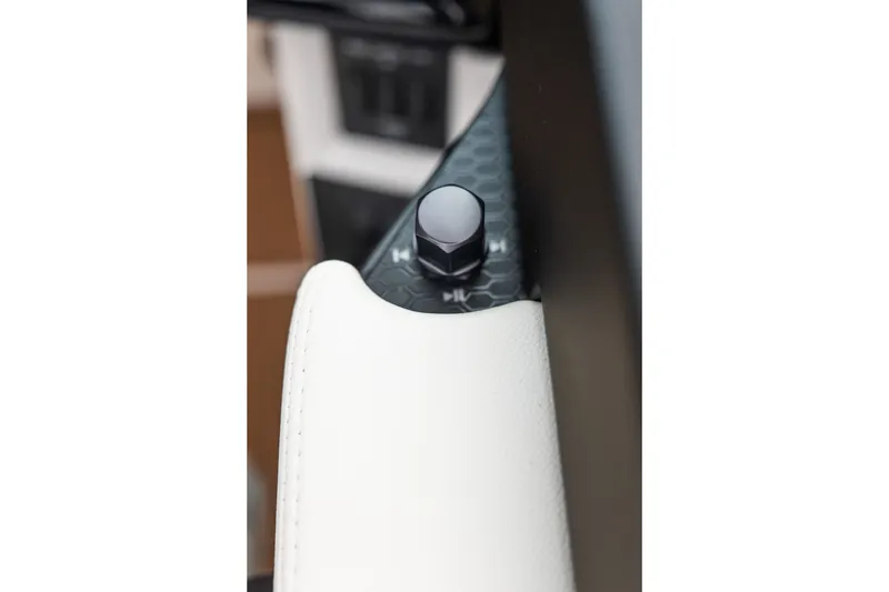 Slide: The Image of Close-up of a control knob in a 2027 MasterCraft NXT20 boat interior. - 46