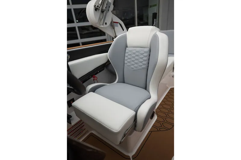 Slide: The Image of 2027 MasterCraft NXT20 boat seat with gray and white upholstery, featuring a hexagonal pattern. - 37
