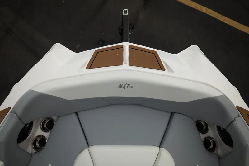 Slide: The Image of 2027 MasterCraft NXT20 boat interior with sleek seating and cup holders. - 39