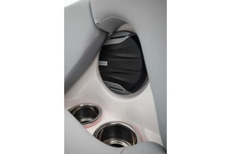 Slide: The Image of 2027 MasterCraft NXT20 interior speaker and cup holders detail. - 40