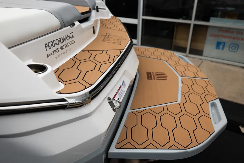 Slide: The Image of 2027 MasterCraft NXT20 boat with hexagonal-patterned deck at Performance Marine Watersports. - 21