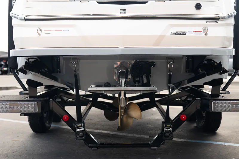 Slide: The Image of Rear view of 2027 MasterCraft NXT20 boat on trailer, showcasing propeller and hull design. - 9