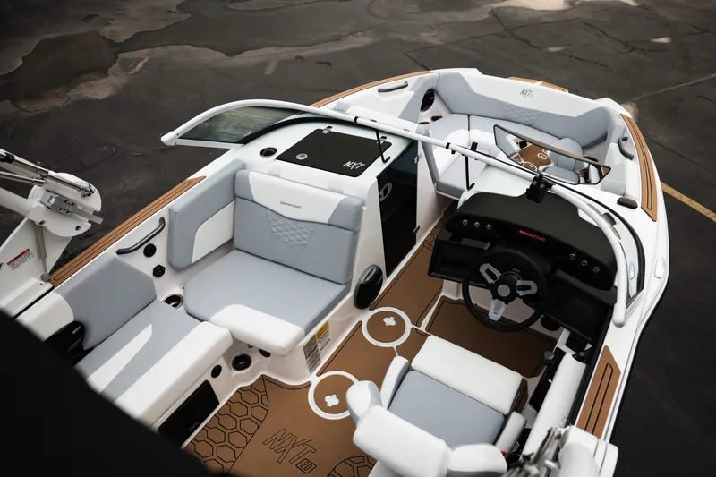 Slide: The Image of 2027 MasterCraft NXT20 boat interior with modern seating and sleek dashboard design. - 24