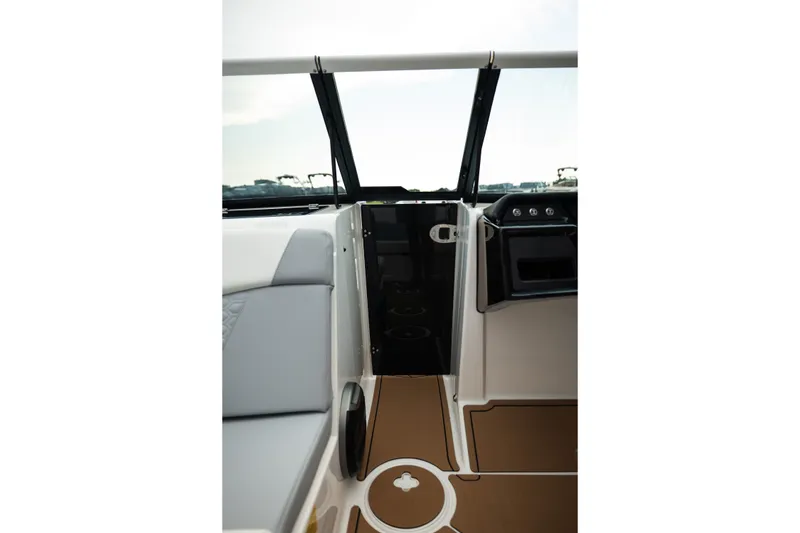 Slide: The Image of Interior view of 2027 MasterCraft NXT20 boat, featuring sleek seating and modern dashboard design. - 47