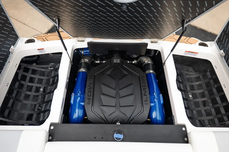 Slide: The Image of 2027 MasterCraft NXT20 engine compartment featuring Ilmor engine with blue accents. - 28
