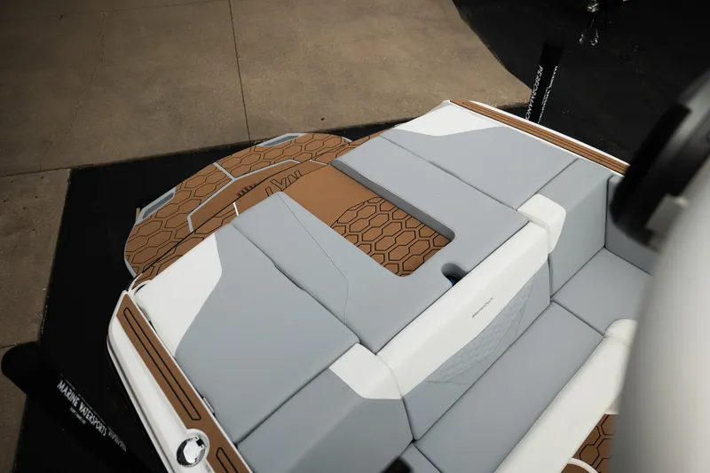 Slide: The Image of 2027 MasterCraft NXT20 boat interior with sleek, modern seating and stylish design elements. - 25