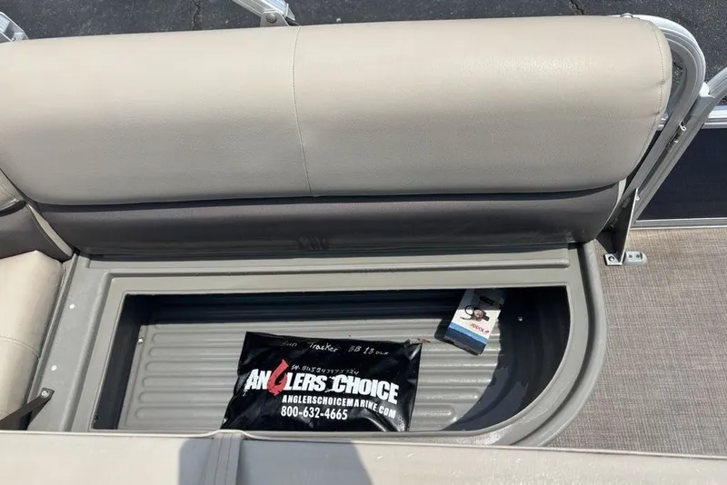 Slide: The Image of Storage compartment in 2024 Sun Tracker Bass Buggy 18 DLX pontoon boat with Anglers Choice bag. - 14