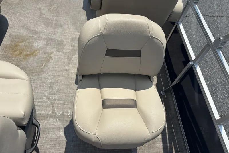 Slide: The Image of 2024 Sun Tracker Bass Buggy 18 DLX beige boat seat on deck. - 23