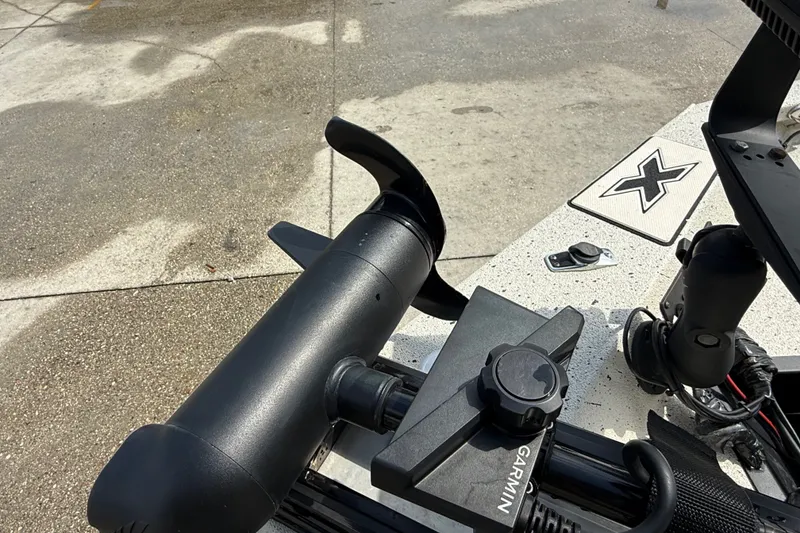 Slide: The Image of Close-up of a Garmin device on a 2018 Express 20 boat deck. - 11