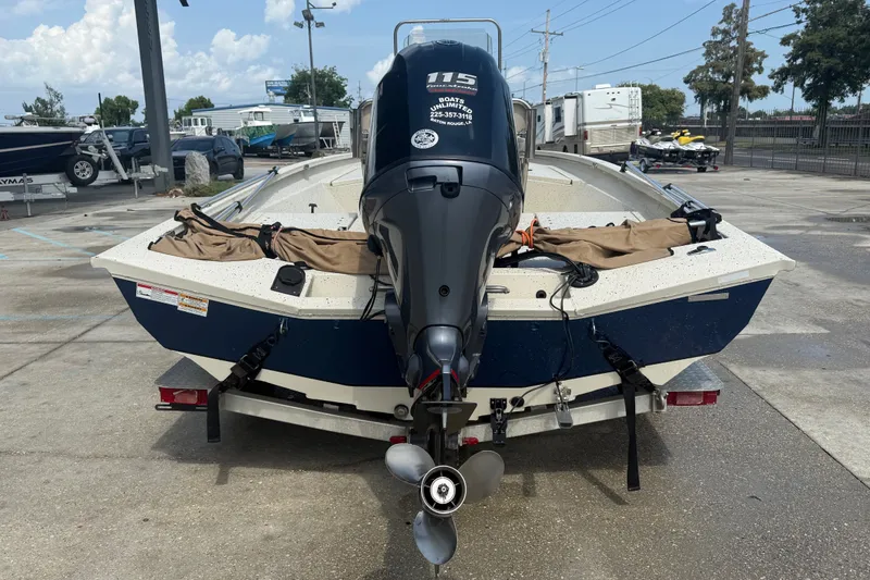 Slide: The Image of 2018 Express 20 boat with 115 HP outboard motor on trailer. - 5
