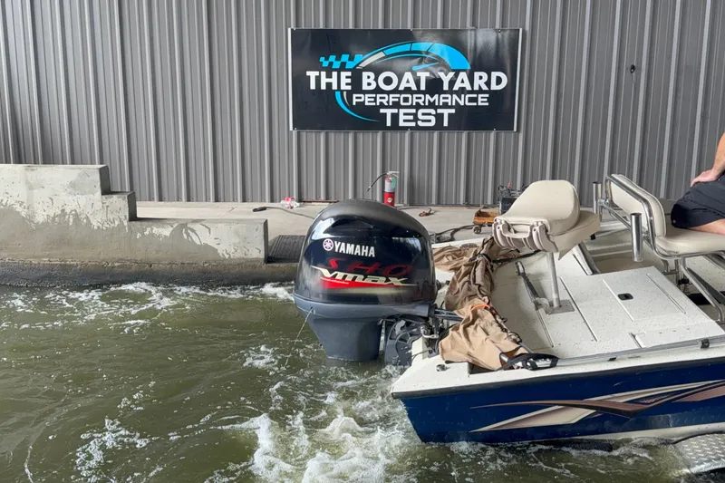 Slide: The Image of 2018 Express 20 boat with Yamaha engine at performance test facility. - 23