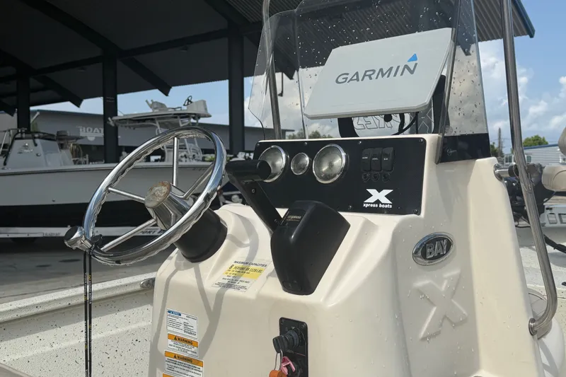 Slide: The Image of Console of a 2018 Express 20 boat with Garmin navigation system. - 15