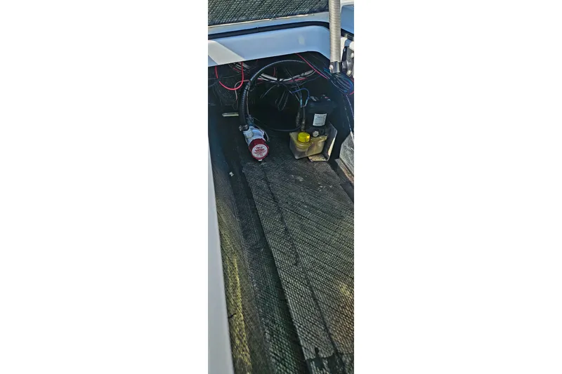 Slide: The Image of Interior view of 2022 East Cape Vantage VHP boat showing wiring and components. - 24