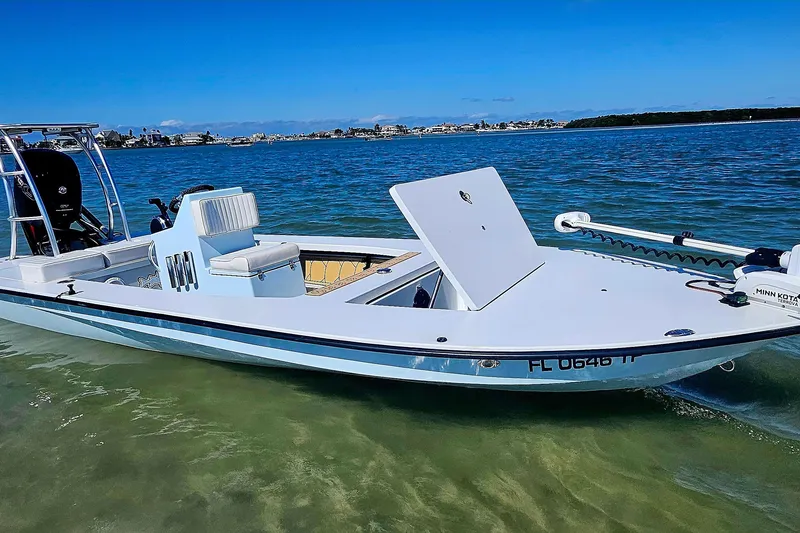 Slide: The Image of 2022 East Cape Vantage VHP boat on clear water, showcasing sleek design and modern features. - 21