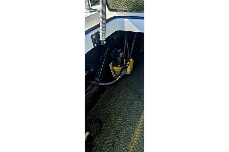 Slide: The Image of Interior view of a 2022 East Cape Vantage VHP boat, showcasing wiring and components. - 22